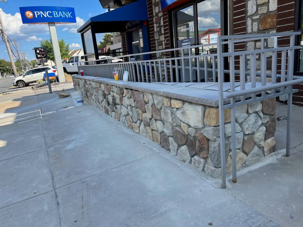 concrete patio stone wall and railing